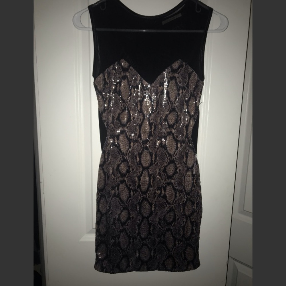 A black snake skin sequin dress